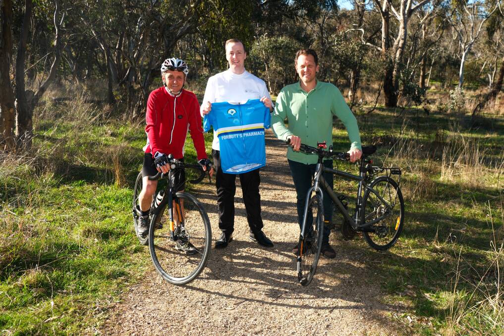 Rotary Club of Bathurst president elect Rob Barlow, Bathurst Business Chamber board member Sam Forbutt, and councillor Jess Jennings with bikes in Boundary Road Reserve. Picture by James Arrow