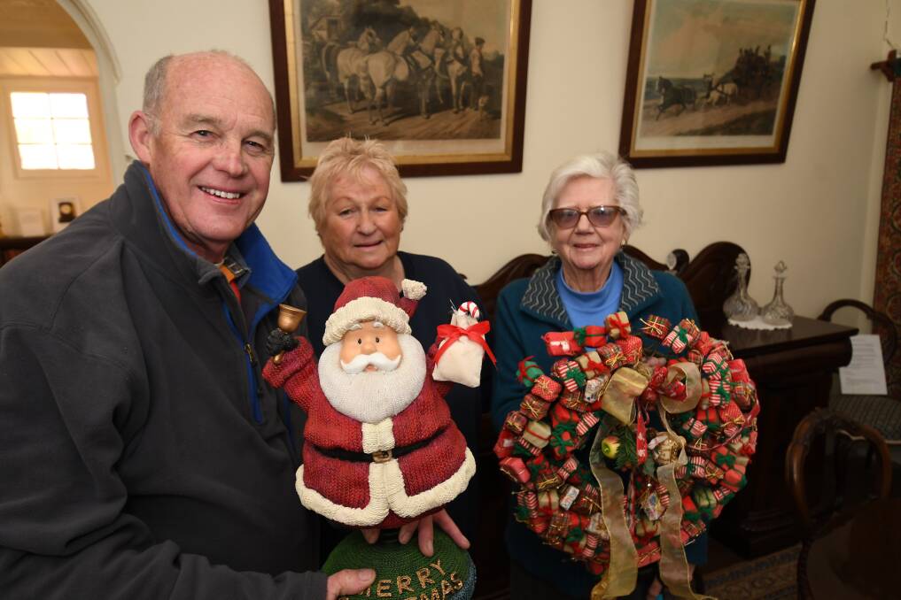 CELEBRATE: Miss Traill's House chair Richard Steele, Barbara Field and Mary Warren ahead of Christmas in July. Photo: CHRIS SEABROOK 071718cmisst