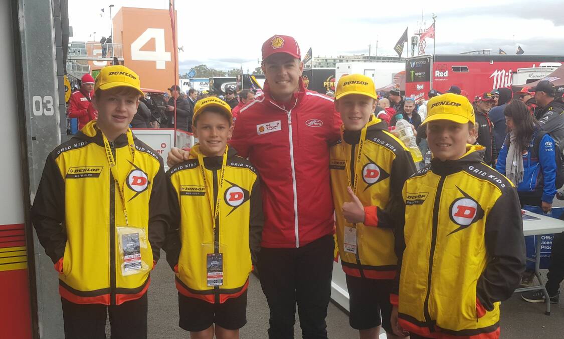 RARE EXPERIENCE: Bathurst's Lawson Latham (second from right) and other Dunlop Grid Kids with Dick Johnson Racing Team Penske's Scott McLaughlin. Photo: SUPPLIED