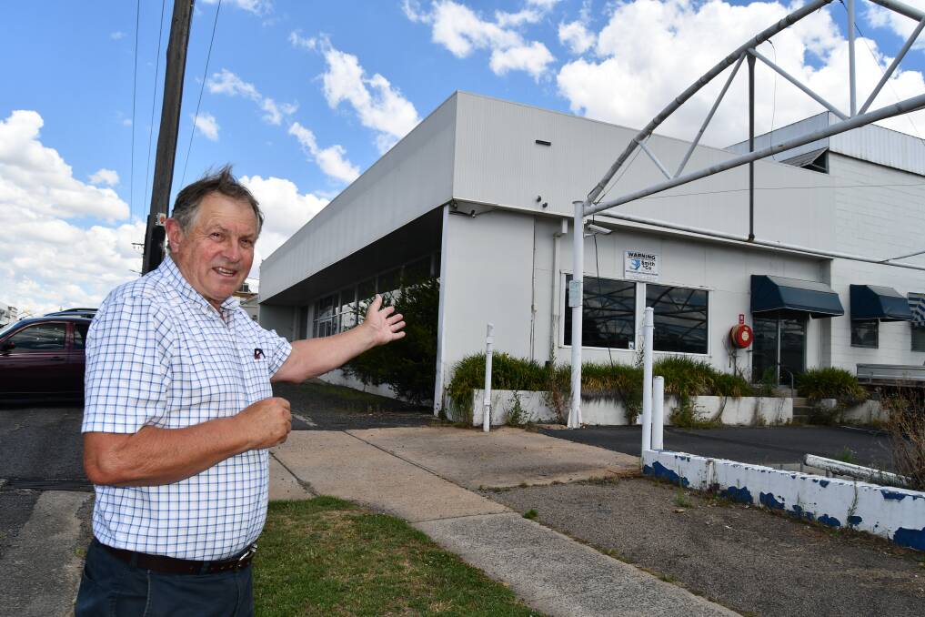 Peter Rogers in front of the former Clancy Motors site, proposed to be the location for the Bathurst Integrated Medical Centre. Picture by Rachel Chamberlain