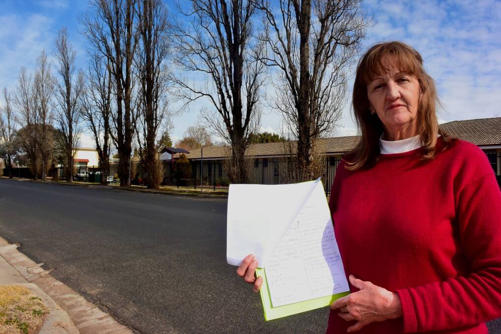SAVE THE TREES: Gormans Hill resident Michelle Horwood has started a petition to stop the removal of poplar trees on Gormans Hill road. Photo: RACHEL CHAMBERLAIN 071218rctree1
