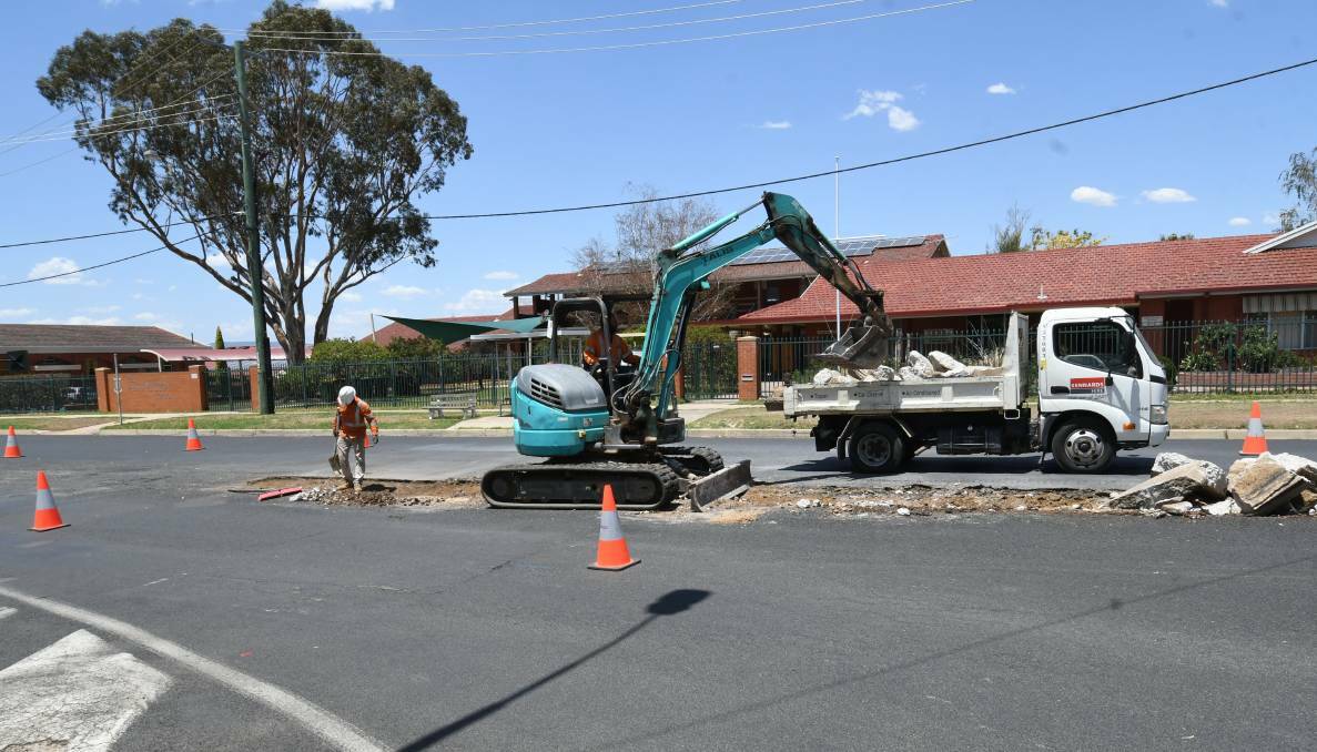Crews got to work physically removing the traffic islands on Mitre and Suttor streets on Wednesday. Photo: CHRIS SEABROOK 012220cisland1