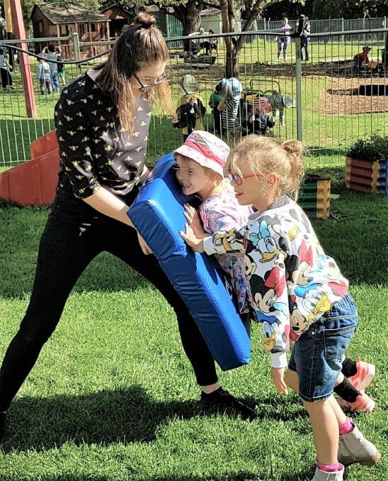 GREAT ENVIRONMENT: Speech Pathologist Abby Patis with Faith Carter and Anna Lesh at the Bathurst Early Childhood Intervention Service (BECIS). Photo: SUPPLIED
