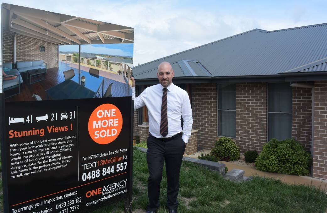 POSTIVE, BUT REALISTIC: One Agency Bestwick Real Estate's Mitchell Bestwick at a property that was recently sold. Photo: RACHEL CHAMBERLAIN