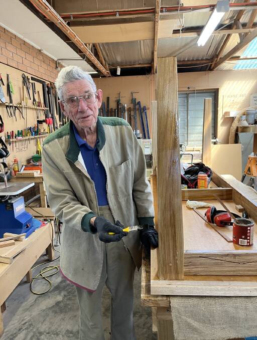 Dick Smith working on the table in the Woodies workshop. Picture supplied