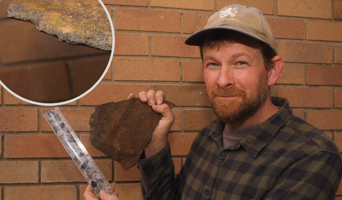 FLASHBACK: Tim Bergen, pictured in May 2020, with the stone he found near the summit of Mount Panorama. Photos: SAM BOLT 