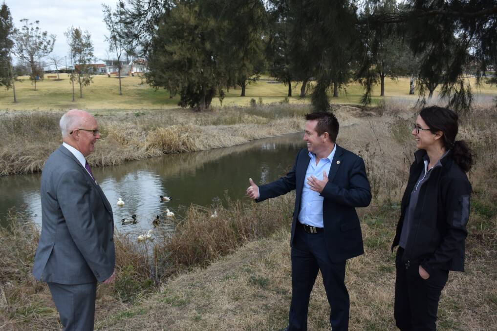 PROJECT FUNDING: Member for Bathurst Paul Toole (centre) with mayor Graeme Hanger and council's environmental programs coordinator Stevie Armstrong at the Macquarie River. Photo: RACHEL CHAMBERLAIN 081718rcriver1