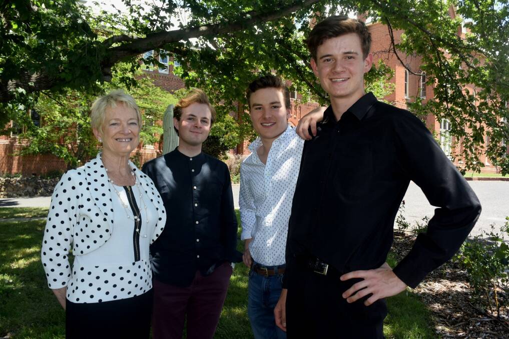 THRILLED: Head of College Dr Anne Wenham with her All-Rounder students Oliver O'Toole, Jerome Arrow and Dominic McCrossin. Photo: RACHEL CHAMBERLAIN 121417rchsc3a