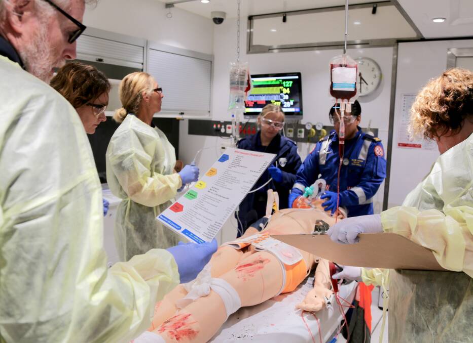 HANDS-ON EXPERIENCE: The mobile simulated clinical training bus gives health professionals a sense of what emergency situations are like. Photo: NSW HETI