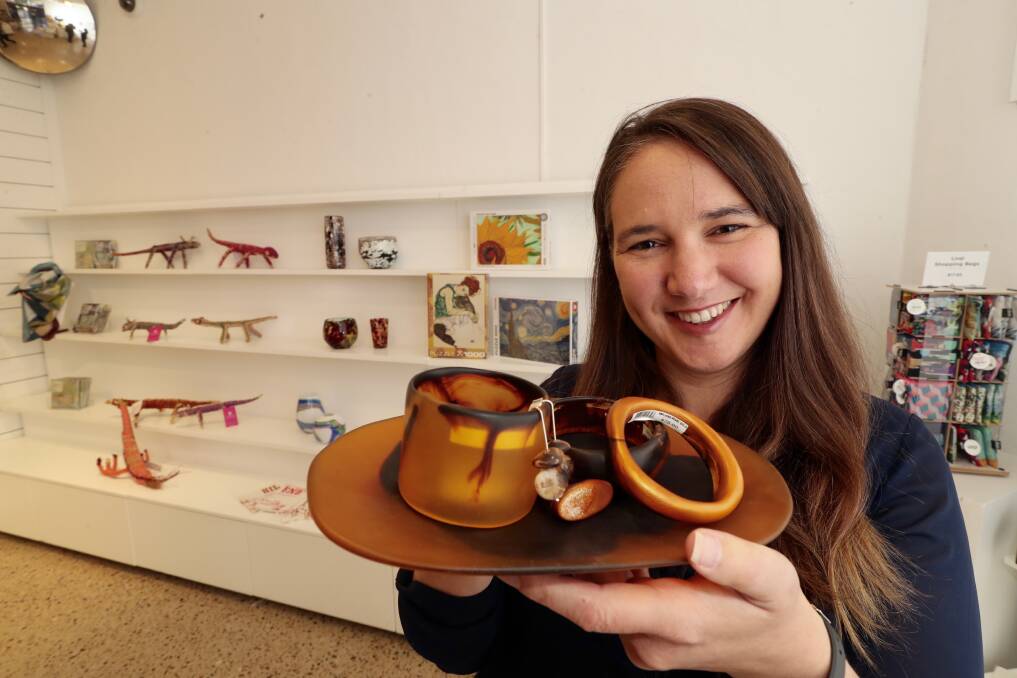UNIQUE GIFTS: Bathurst Regional Art Gallery's Jo Dicksen showing off some of the items available in the pop-up shop. Photo: PHIL BLATCH