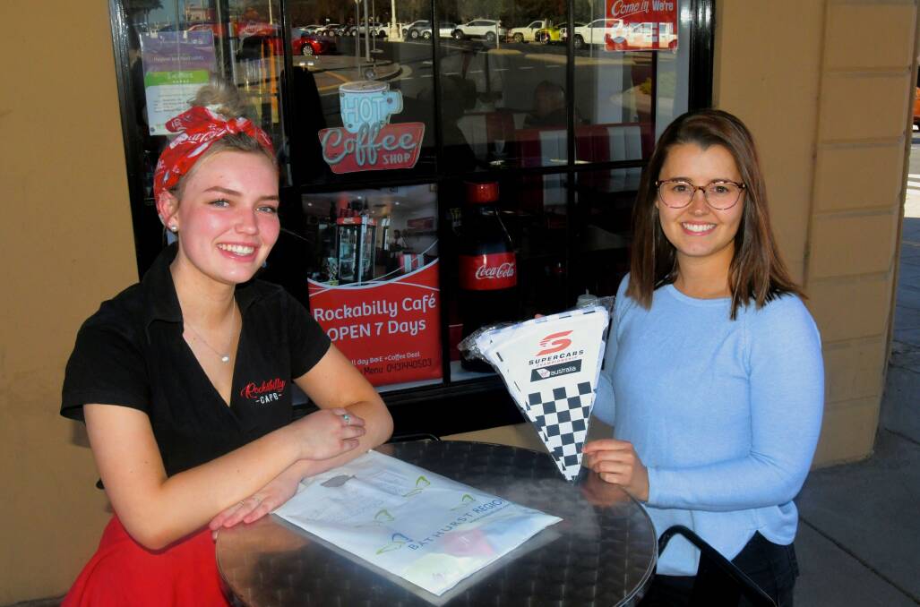 Rockabilly Café waitress Claire Varian with Bathurst Regional Council events team member Amanda Marks. Rockabilly participated in the Bathurst 1000 window display competition. 