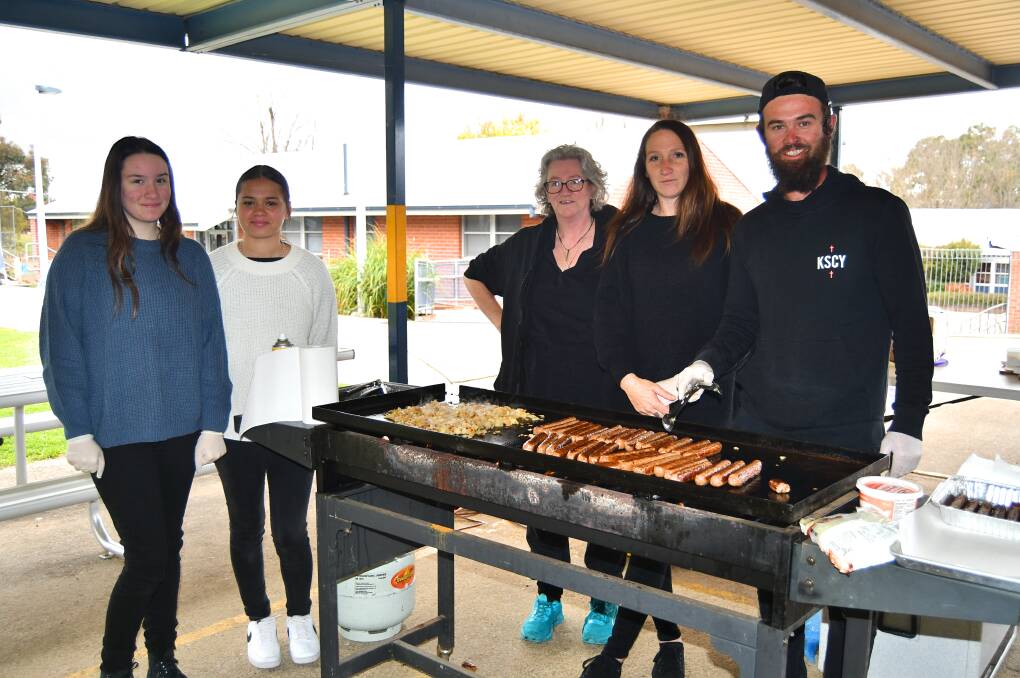 Past students and parents running the barbecue at Bathurst South Public School. 