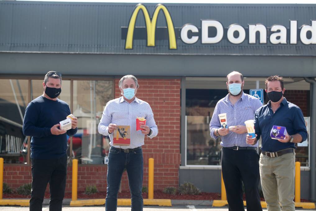 MACCAS FOR VAXXERS: Councillor Warren Aubin, local owner of McDonald's Todd Bryant, staff member Bryce Yule and MP Paul Toole. Photo: PHIL BLATCH
