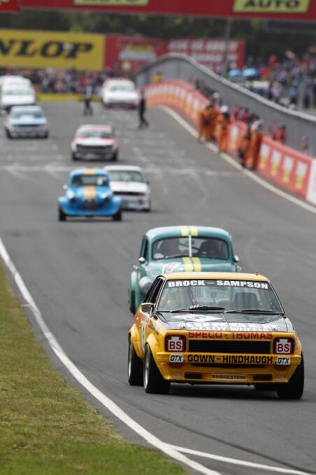 TRIBUTE: Peter Brock's iconic cars were brought back to Mount Panorama for another lap at the Bathurst 1000. Photo: PHIL BLATCH