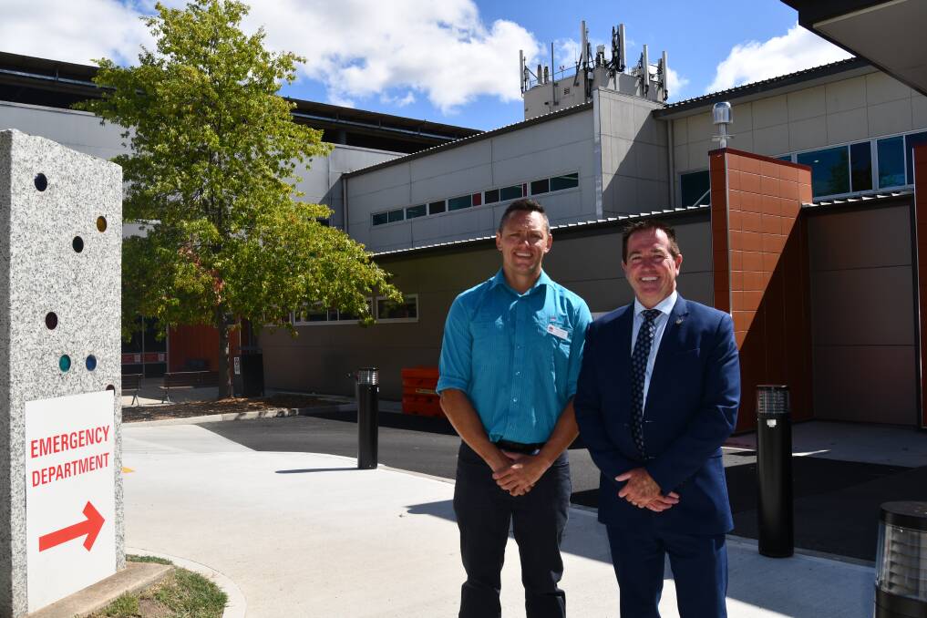 Chief radiographer Corey Hemopo with Member for Bathurst Paul Toole outside the extension that houses the MRI machine. Picture by Rachel Chamberlain