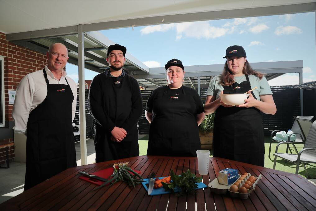 Vivability CEO Nick Packham with clients Jack Sadler, Maggie Cummings and Jordan Zammitt, who are excited about VIVA eats. Photo: PHIL BLATCH
