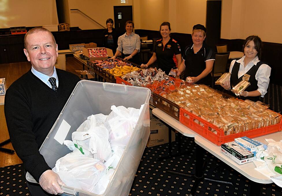 KEEPING BUSY: Bathurst RSL general manager Peter Sargent and staff, showing off the catering they have been asked to provide for volunteers at the Mount. 