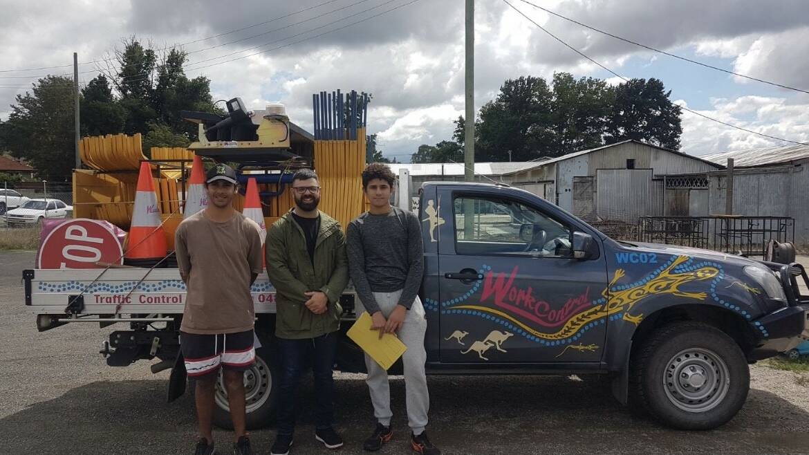 BOYS TO THE BUSH SUCCESS: Jack and Tyrone with Ben Gunn (centre) from Work Control. Mr Gunn assisted the boys in attaining their traffic control certification. 