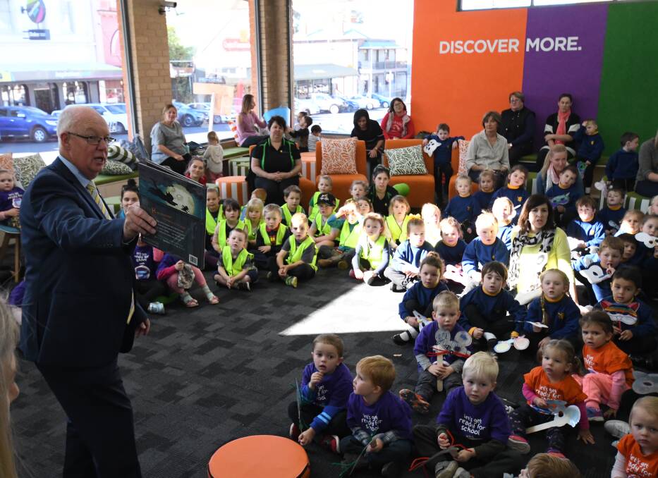 ENGAGING TALE: An animated mayor Graeme Hanger kept children entertained when he read Hickory Dickory Dash on Wednesday. Photo: CHRIS SEABROOK 052318cstory2