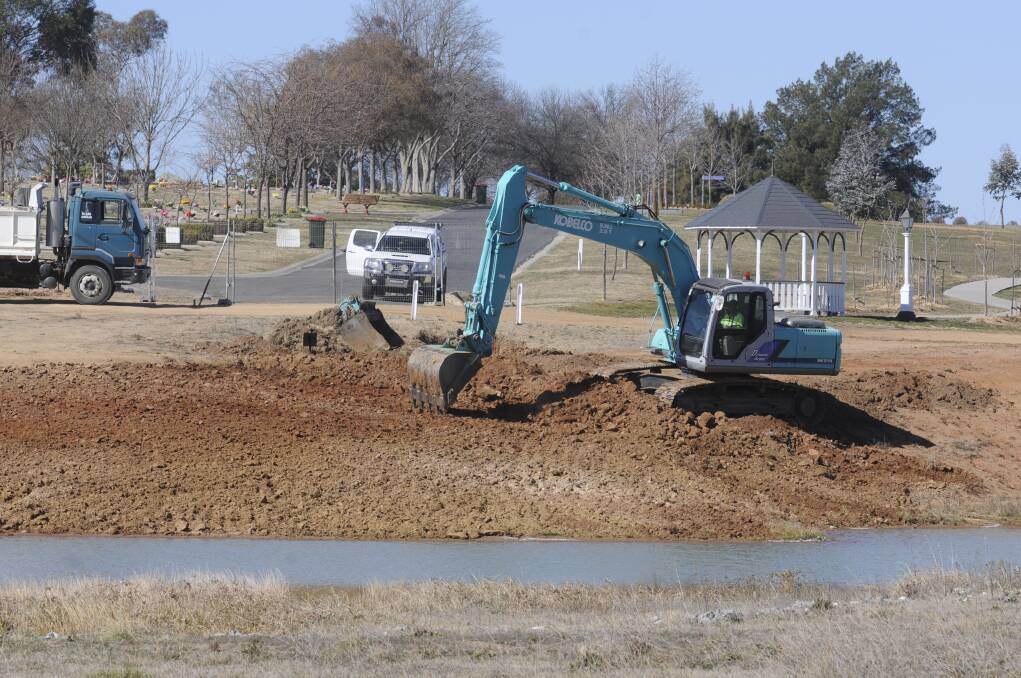 UNDERWAY: Earthworks have commenced at Bathurst Cemetery to improve the look of the reflective pond, which was criticised by councillor Warren Aubin earlier this month. Photo: CHRIS SEABROOK 083017cpond