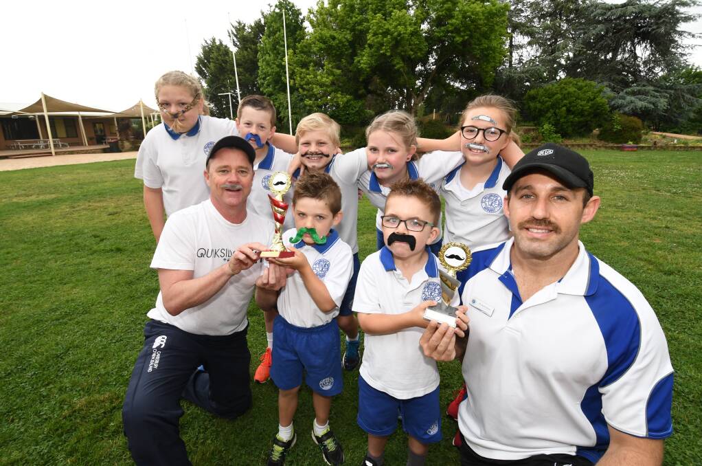 FUN: Teachers Shane Hanley and Jacob Parslow with kindergarten students Billy-Ray Watson and Isaac McCormack, as well as Year 5 students Samantha Seaman, Blayde Burke, Nicholas Newman, Kelsie Richards and Laura Martin- Clark. Photo: CHRIS SEABROOK 112118cmouv1