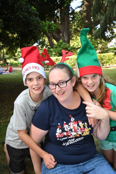 FAMILY FUN: Clare Nelson and her 10-year-old children, Jarrod and Tahlia, posed for a photo at Carols by Candelight. Photo: CHRIS SEABROOK