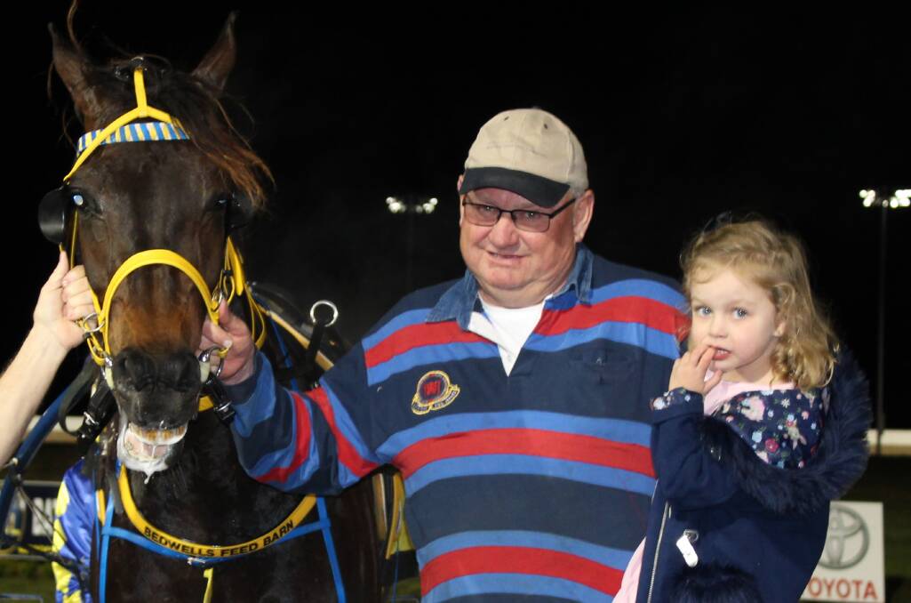 TRAINER: Chris Frisby (pictured, centre) will be hoping his three-year-old filly Jenden Strike will strike gold at the Victoria Oaks Final at Melton on Saturday night. 