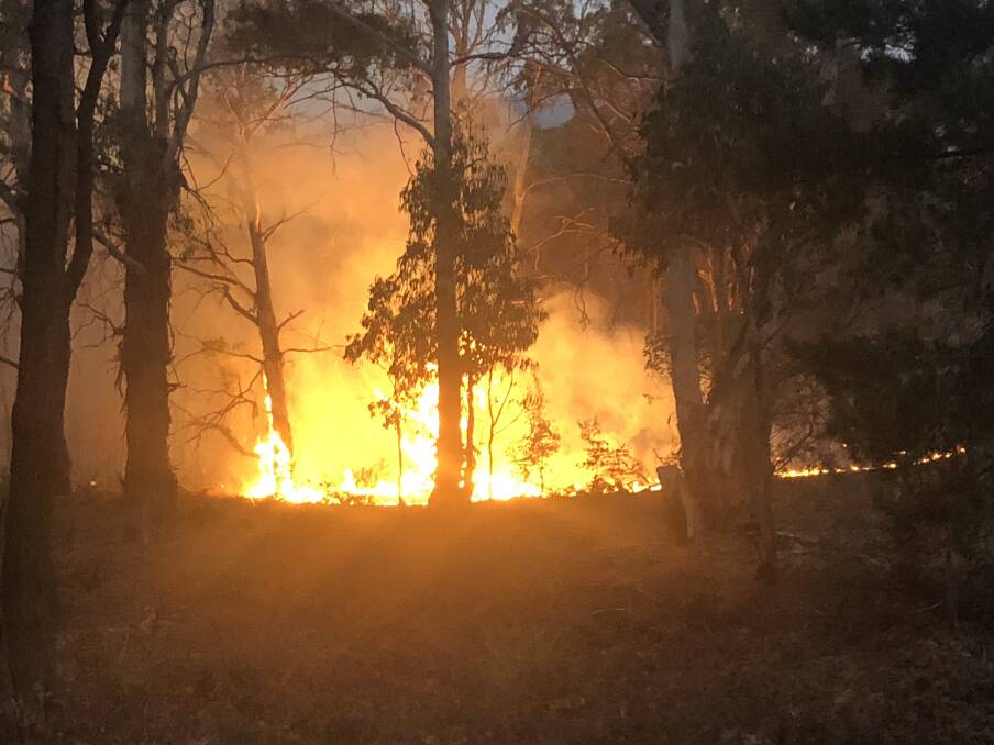 CRISIS: The Palmers Oaky bushfire, between Mudgee and Lithgow, is one of many that have been burning in NSW. Photo: DAVE PEIME