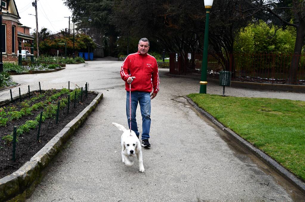 Councillor Warren Aubin in Machattie Park with one of his dogs, Luna. Picture by Rachel Chamberlain