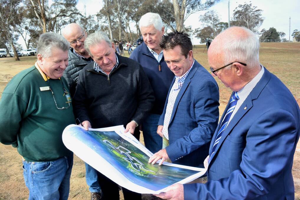 PLEASED: Mount Panorama Second Track Action Group members Lachlan Sullivan, Geoff Fry, Robert 'Stumpy' Taylor and Bruce Morgan looking at the concept design with member for Bathurst Paul Toole and mayor Graeme Hanger. Photo: RACHEL CHAMBERLAIN 071918rctrack4
