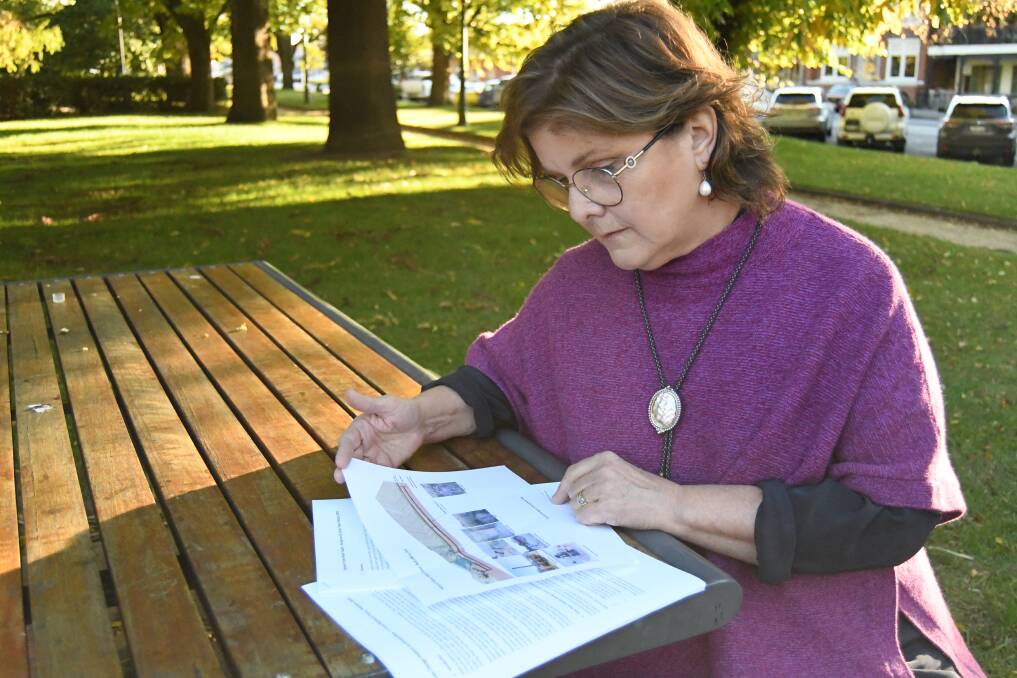 Councillor Marg Hogan reviewing diagrams of the historic water tunnel in Bathurst. Picture by Rachel Chamberlain