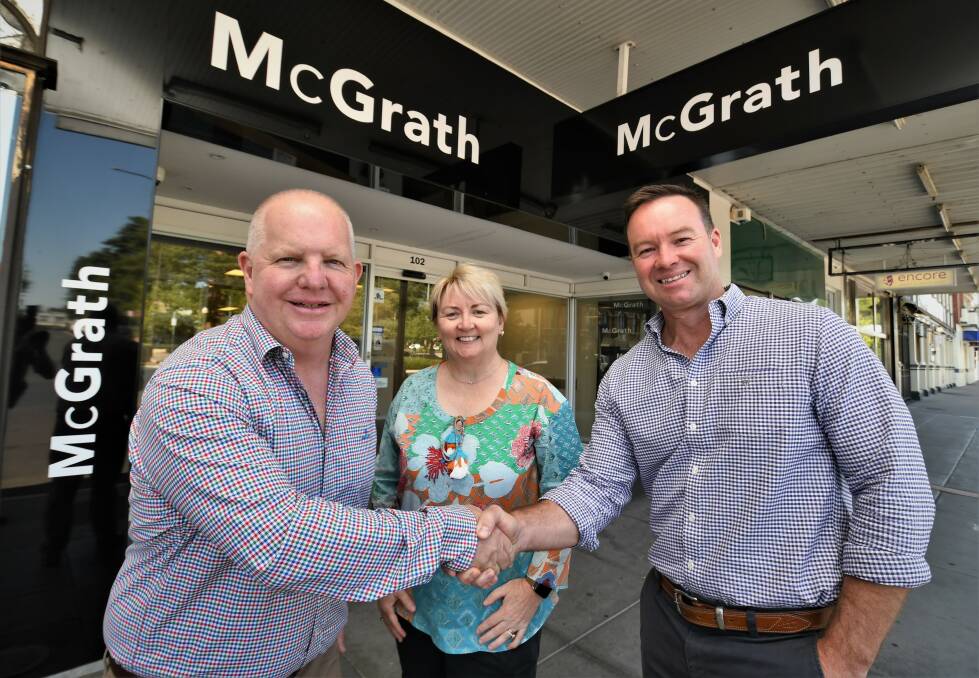 Michael and Stacey Whittaker with McGrath Bathurst director Josh Fitzgerald outside the rebranded Bathurst Real Estate premises. Picture by Chris Seabrook 