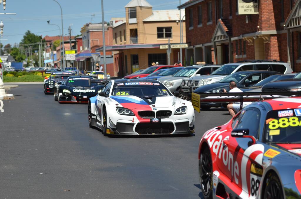 PARADE: Driver Chaz Mostert, who is also a competitor in the Supercars Championship, drove the Team Schnitzer #42 BMW through George Street as part of the inaugural Track to Town for the Bathurst 12 Hour. Photo: ANYA WHITELAW