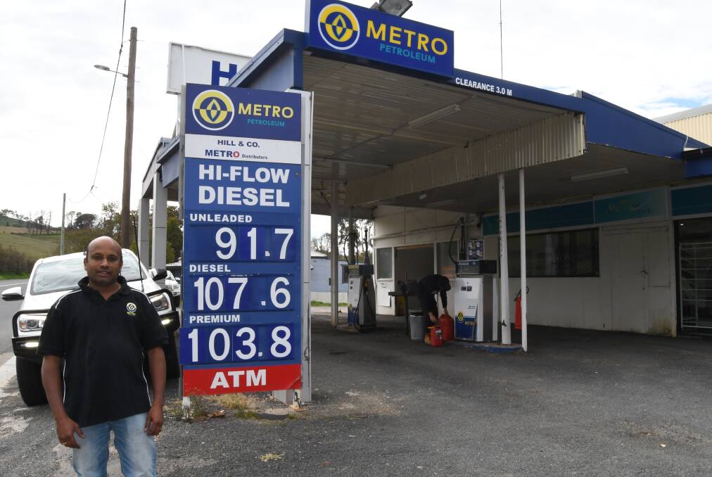 PRICES SLASHED: Owner of the two Metro Petroleum retailers, Sri Rangineni, at the Perthville store on Monday. Photo: RACHEL CHAMBERLAIN