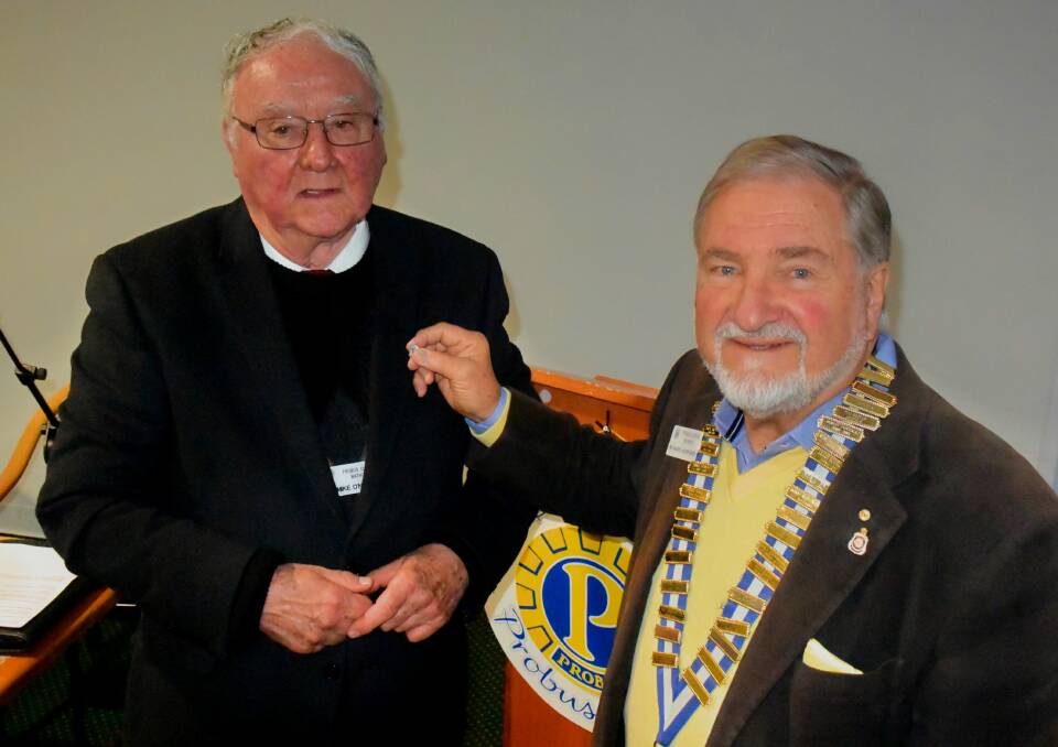 PROBUS LEGACY: Mike O'Neill (left) being presented his life membership pin by Probus Club of Bathurst president Richard Hurford (right). 