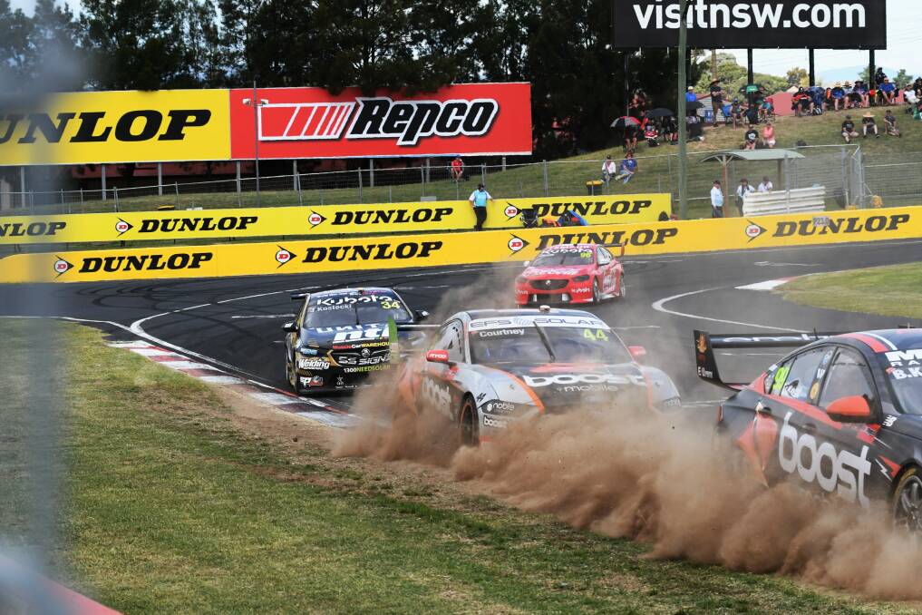 ON-TRACK ACTION: Brodie Kostecki, James Courtney, Jake Kostecki and Maculey Jones coming round the last corner on Saturday during the first race of the Bathurst 500. Photo: CHRIS SEABROOK 022721cscars6