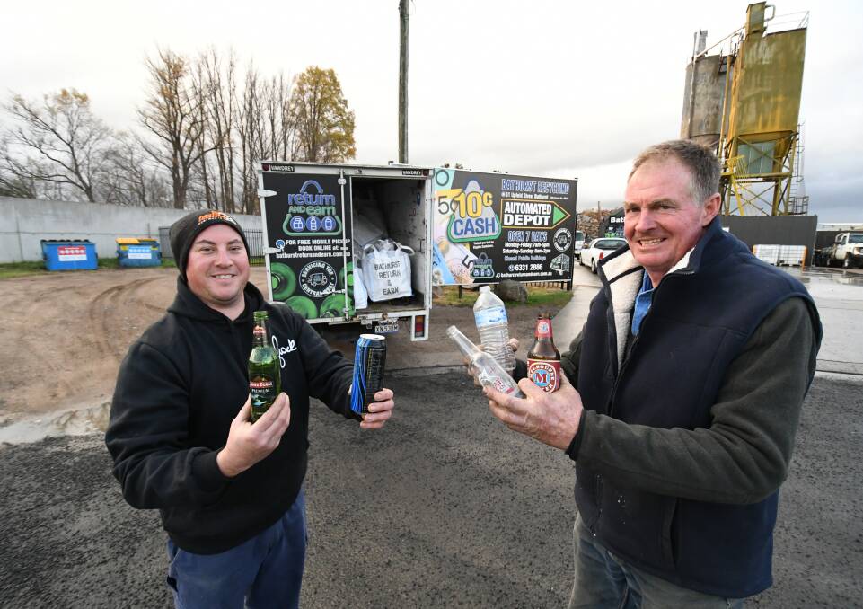 COLLECTORS: Bathurst Recycling's Jarrod Gotch and Craig Clark with their collection truck that travels the region. Photo: CHRIS SEABROOK 052919cash1