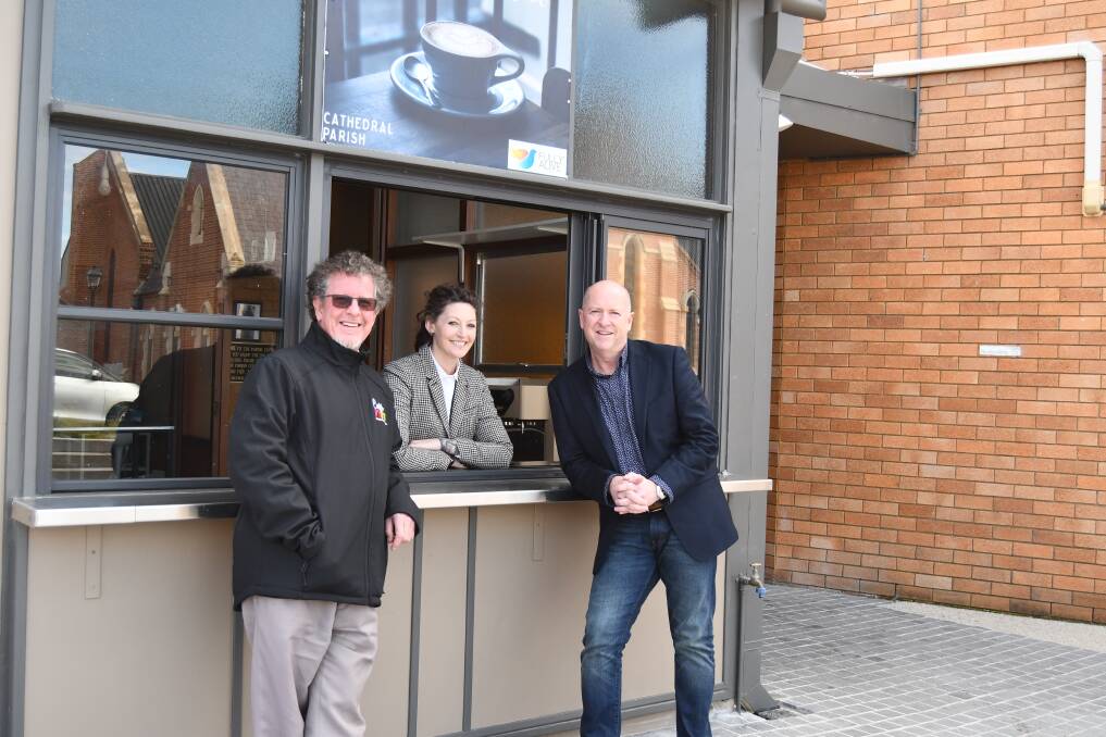 Father Paul Devitt with Vivability's April See and Nick Packham at the location for the new café. Photo: RACHEL CHAMBERLAIN 