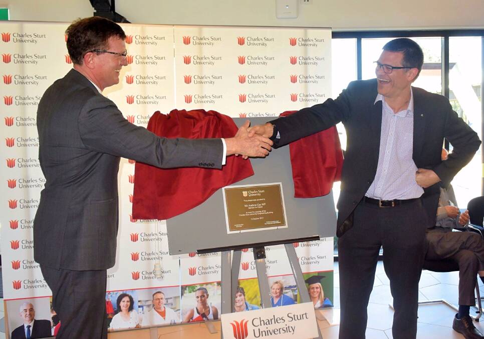 GREAT MOMENT: Member for Calare Andrew Gee and Charles Sturt University's Vice Chancellor professor Andrew Vann after unveiling the plaque for the new engineering building. Photo: RACHEL CHAMBERLAIN 101317rccsu