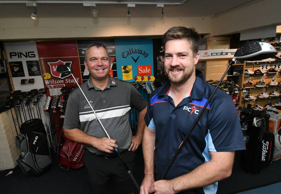 TIME TO FUNDRAISE: Bathurst club professional Matt Barrett with Bathurst PCYC manager David Hitchick, getting ready for Sunday's charity golf day. Photo: CHRIS SEABROOK 030519cpcycgolf