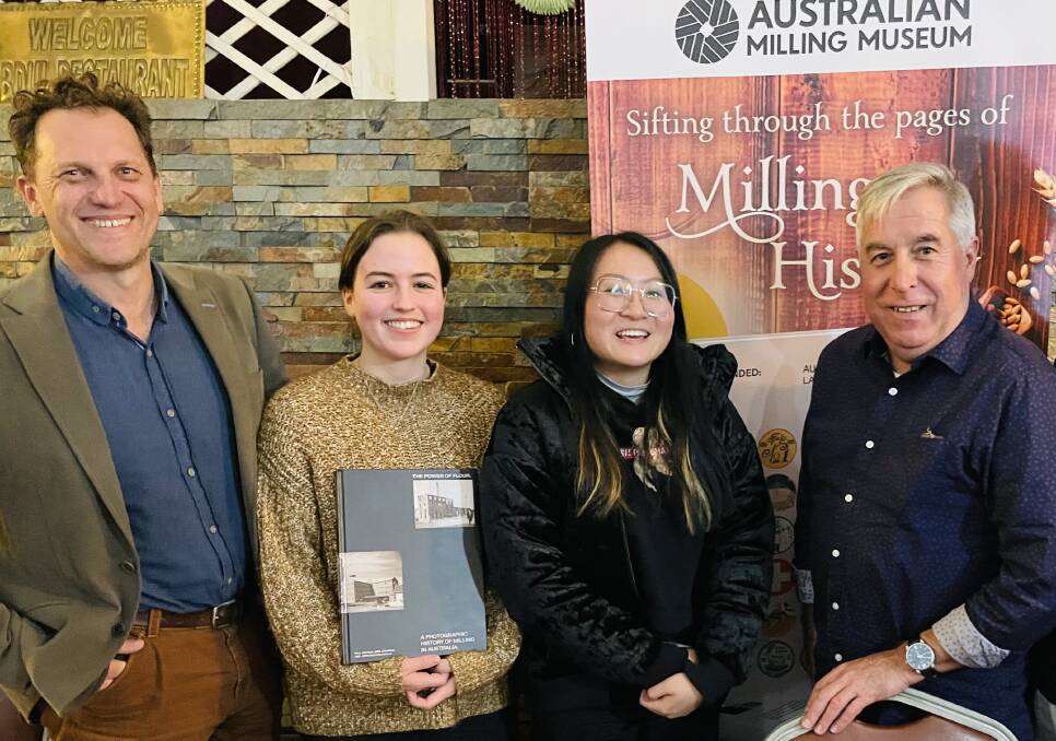 Dr Jess Jennings (left) and Professor Paul Ashton (right( with Lucy Chambers and Caitlin Ong, who did the graphic design and layout for their milling books. Picture supplied