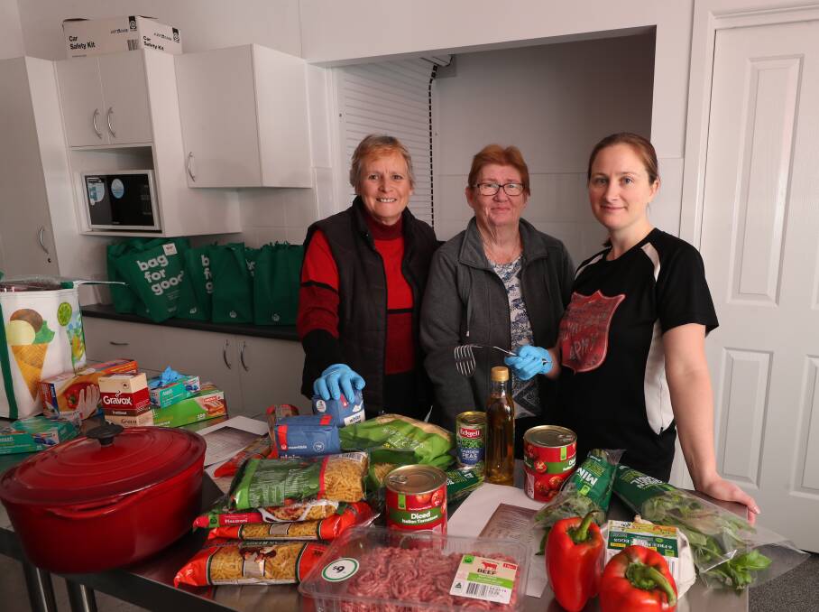 HELPERS ALWAYS NEEDED: Uniting Safe Shelter coordinator Julie Greig with Lynda Couchman and Salvation Army Lieutenant Kate Cathcart at a cooking bee held earlier this month. Photo: PHIL BLATCH 050119pbcook1