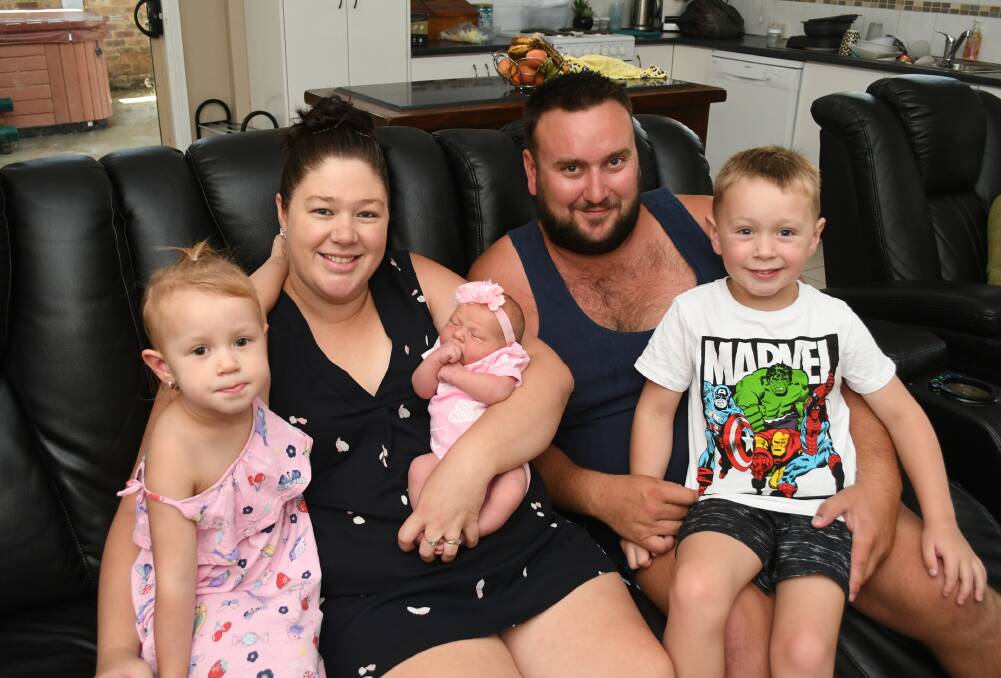 HAPPY FAMILY: Parents Adam and Kylee Connell with their children Darcey, 2, newborn Lexie and five-year-old Logan. Photo: CHRIS SEABROOK 012819carbub1