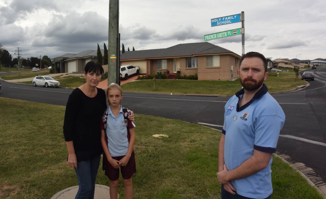 CONCERNED: Sharon Francis with her daughter Mariah Bowrey and councillor Alex Christian on the corner of French Smith Place and Marsden Lane, near Holy Family School.