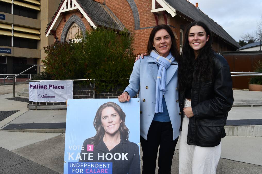 ELECTION DAY: Independent candidate Kate Hook with her daughter Maddie at the St Stephen's Presbyterian Church Hall, Bathurst. Photo: RACHEL CHAMBERLAIN