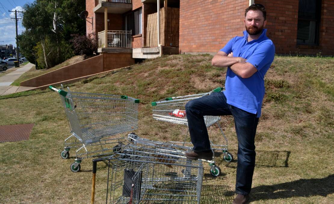 NOT GOOD ENOUGH: Councillor Alex Christian is fired up about the number of trolleys being abandoned in Bathurst streets, which he says big businesses are doing very little to address. Photo: RACHEL CHAMBERLAIN 040518rctrolley1