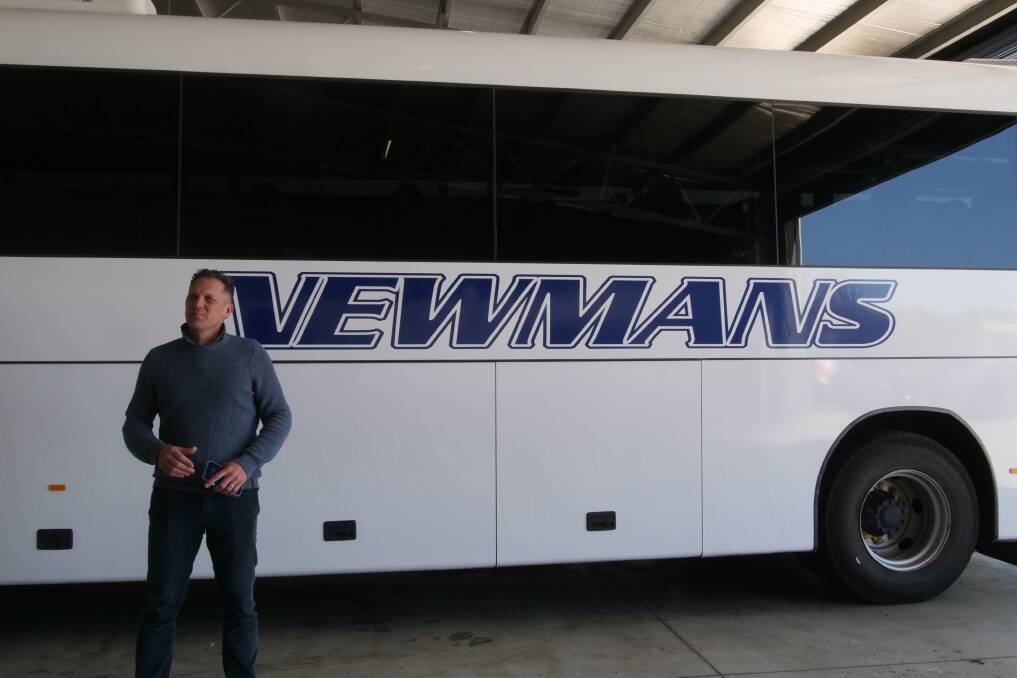 Mayor Jess Jennings standing in front of a Newmans bus. Picture supplied