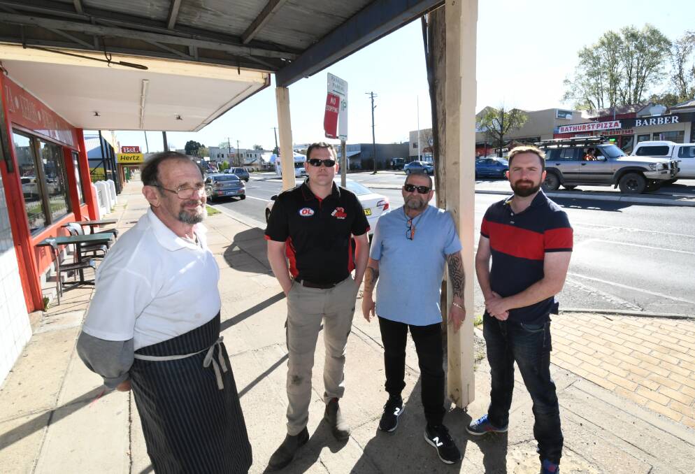 TIMING ISSUE: Little Acres butcher owner Jim Jordan, Matt Holden from the 4WD Zone, and Victor Issa, the owner of Bathurst Pizza and Vic's Place, with councillor Alex Christian. Photo: CHRIS SEABROOK 100119ctimesup