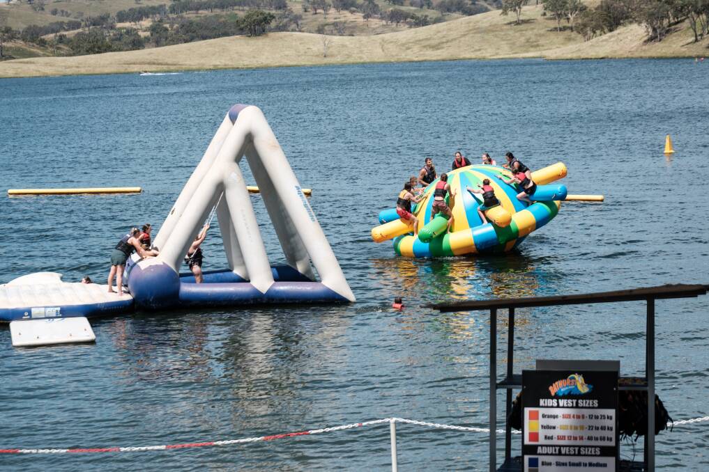 People climbing on the inflatable equipment at Bathurst Aqua Park in February, 2024. Picture by James Arrow