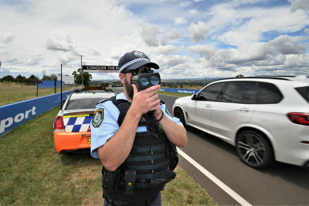 ON PATROL: Leading Senior Constable Josh Marsh monitoring speed on Conrod Straight, Mount Panorama. Photo: CHRIS SEABROOK 012422chiway1